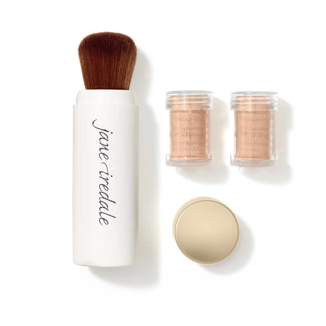 Makeup brush set with three small containers of powder on a white background, featuring the brand 'jane iredale'.
