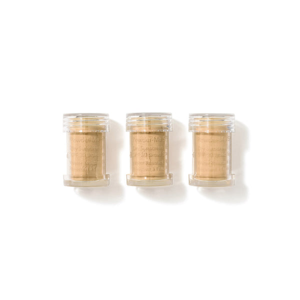 Three small clear plastic jars filled with a light tan powder, arranged side by side on a white background.