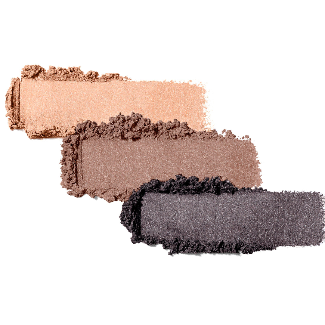 Three makeup swatches in beige, brown, and black on a white background