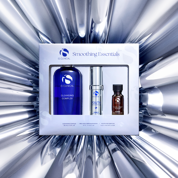 IS Clinical Smoothing Essentials set with three products on a metallic background