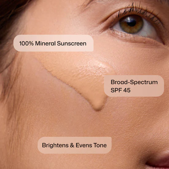 Close-up of a person's face with text indicating 100% mineral sunscreen, Broad-Spectrum SPF 45, and brightening & even tone benefits.