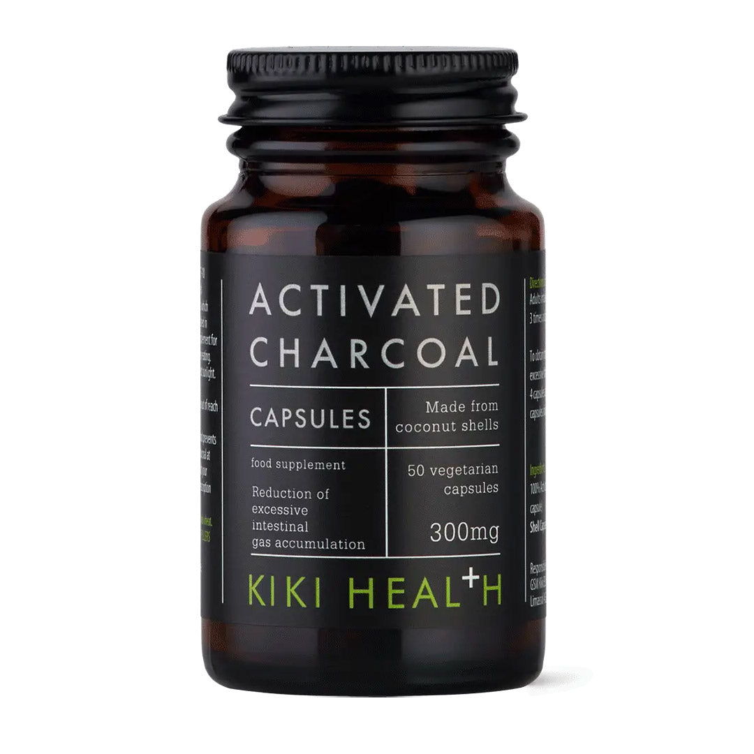 Bottle of Kiki Health activated charcoal capsules on a white background