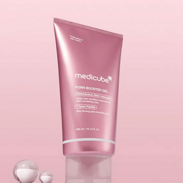 Pink tube of Medicube product on a pink background