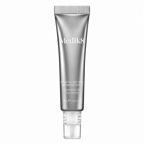 Medik8 Crystal Retinal Ceramide Eye Cream in a sleek silver squeeze tube with a clear cap, centered on a plain white background.