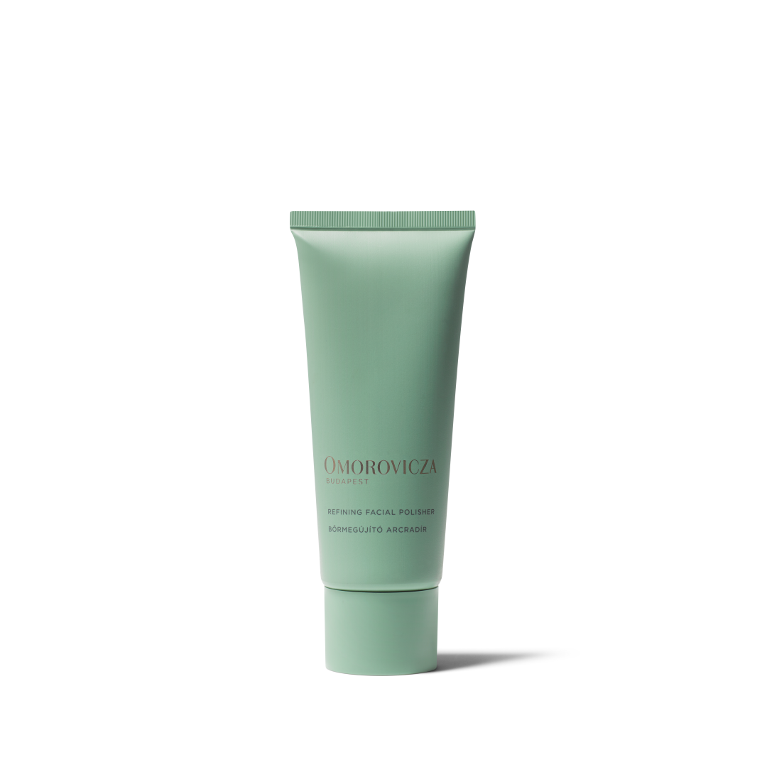 A mint green squeeze tube of Omorovicza Retinol Facial Volumizer on a clean white background.