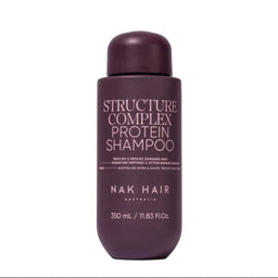 A bottle of NAK HAIR Structure Complex Protein Shampoo in a deep plum purple color, shown against a plain white background.