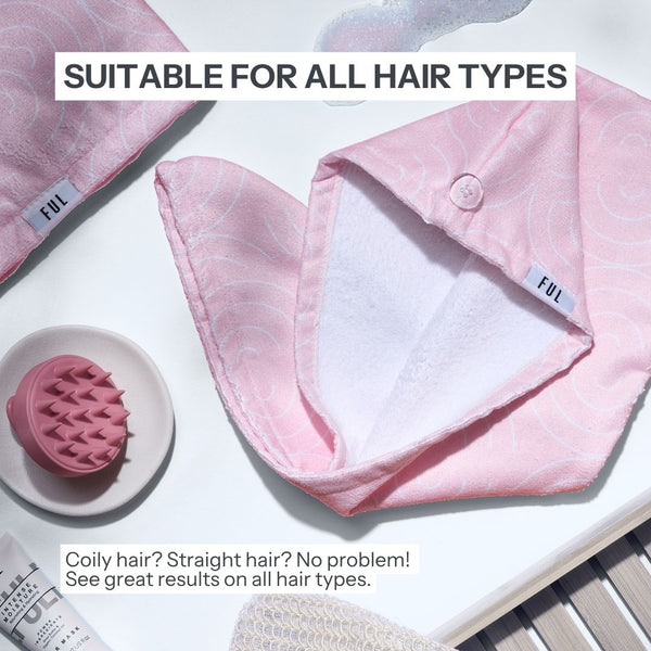 Pink hair accessory with white interior on a white surface, suitable for all hair types.