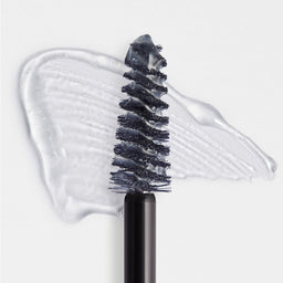 Eyebrow brush with black bristles and clear gel on a white background