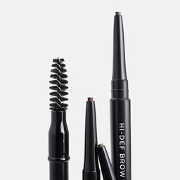 Set of black eyebrow pencils on a light gray background