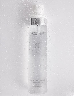 Revitalash cosmetic bottle on a gray background