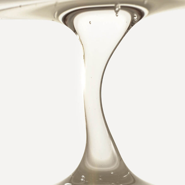 Close-up of a glass vase with a smooth, reflective surface.
