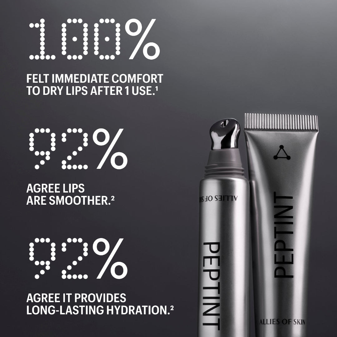 Three silver cosmetic tubes and a bottle labeled PEPTINT are arranged on a dark reflective surface with large white marketing text about dry lips and smoother lips.