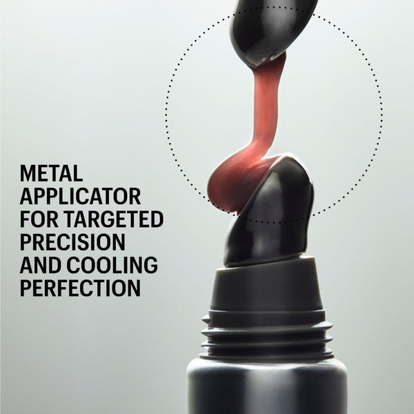 A close-up promotional shot of a black metal makeup applicator being pressed into a dark cosmetic tube, with a pink-red product being dispensed. Text on the left reads 'METAL APPLICATOR FOR TARGETED PRECISION AND COOLING PERFECTION' and 'SHADE UTOPIA' appears at the top.