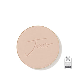 Round beige compact with 'Fenty' branding on a white background