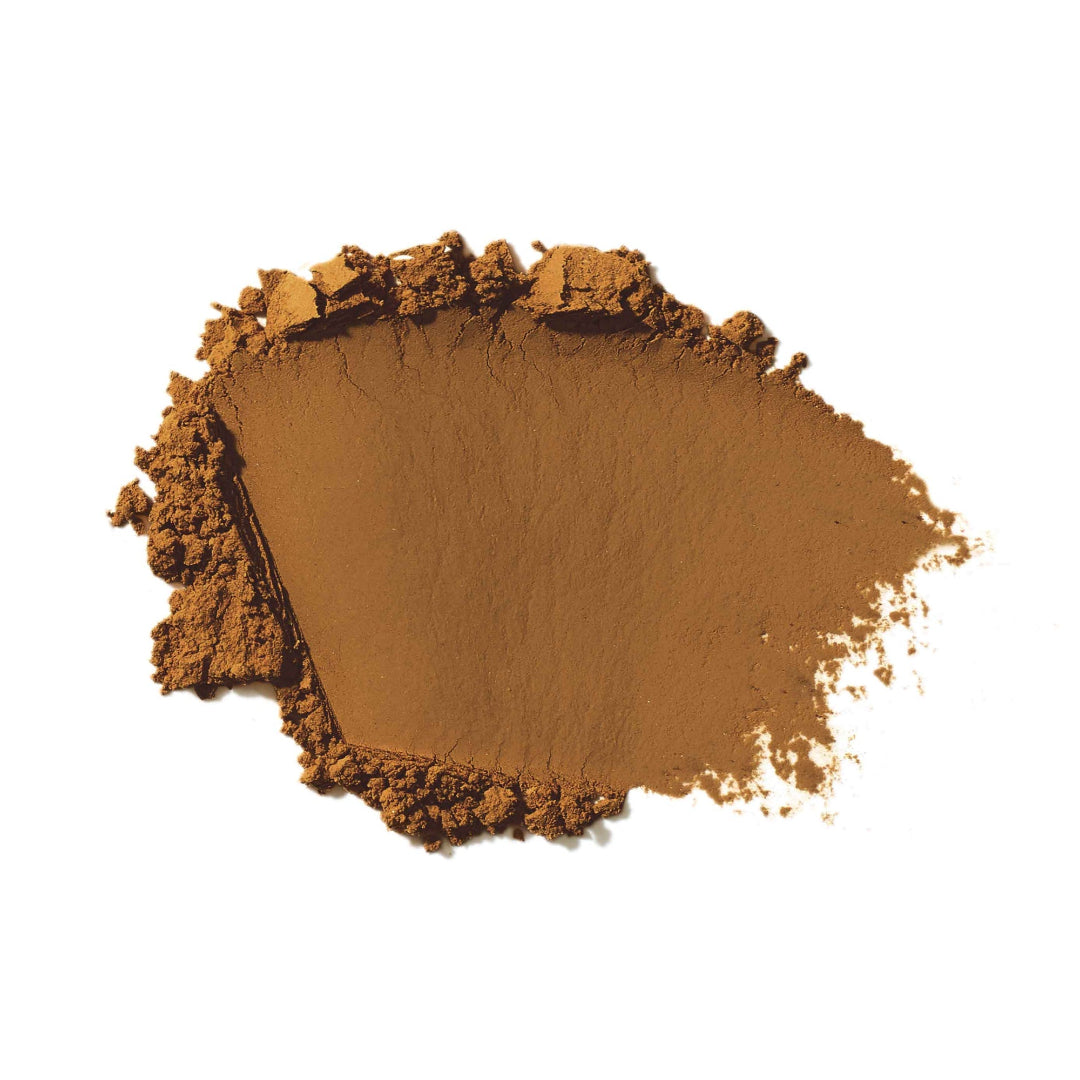 Brown makeup powder on a white background