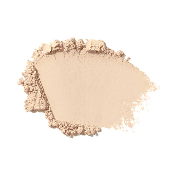 Light beige makeup powder on a white background