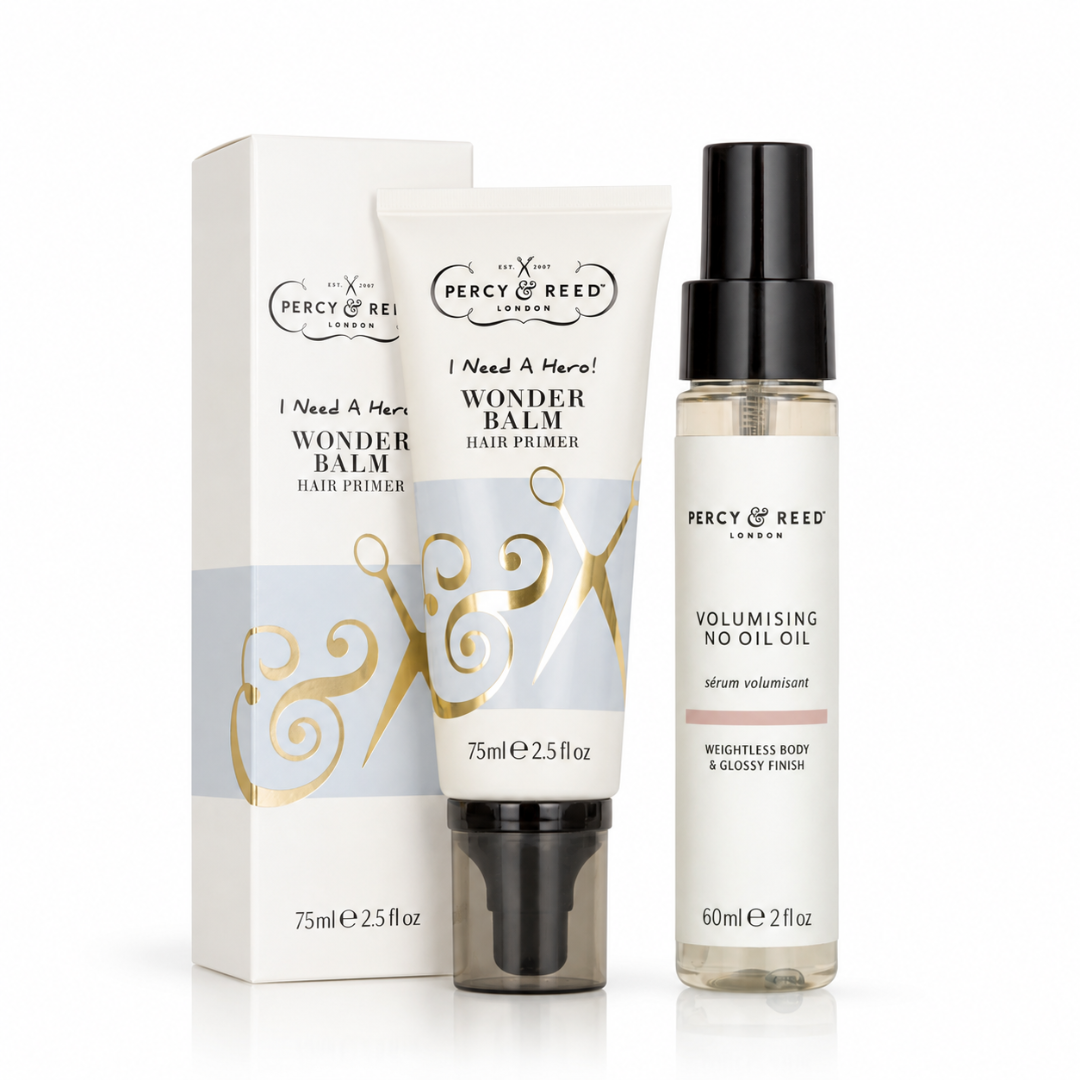 Percy & Reed London hair care set featuring a Wonder Balm Hair Primer tube with its box and a Volumising No Oil Oil bottle, on a white background.