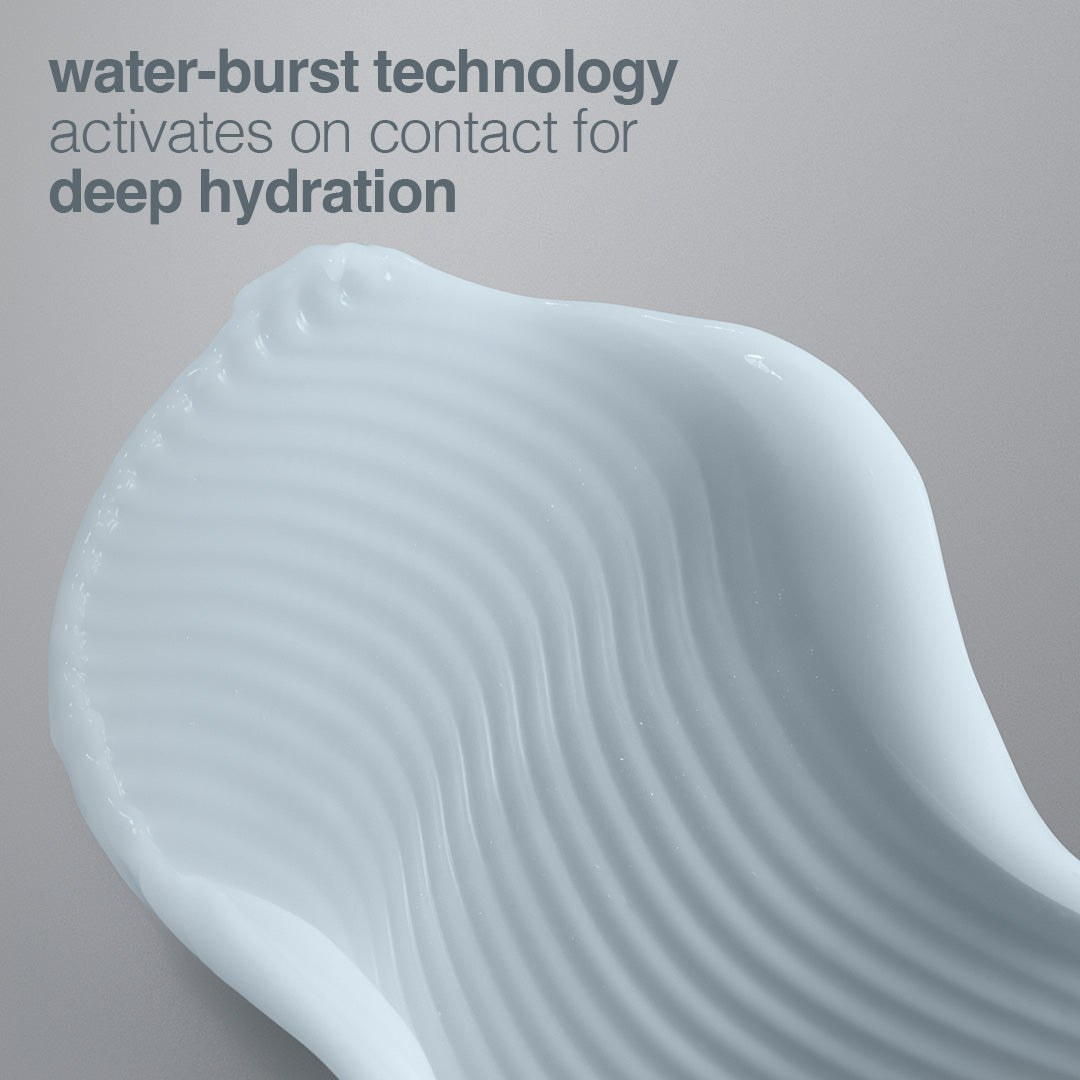 Close-up of a textured cream with 'water-burst technology' text on a gray background