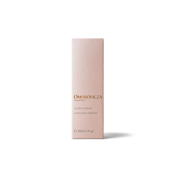 A tall, slim rectangular box for Omorovicza Queen Serum in Keralino Serum, shown in a soft blush pink color with gold lettering, set against a plain white background.