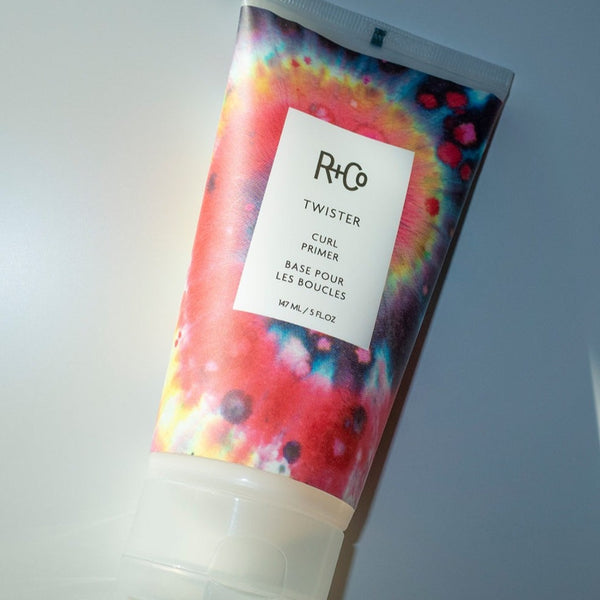 a closeup of a R+Co Twister Curl Primer tube