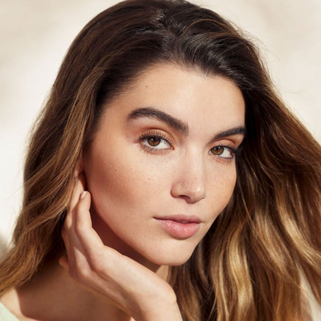 a close up of a models face