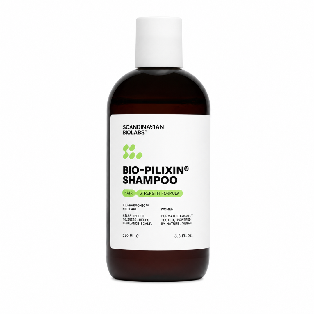 A 250 mL bottle of Scandinavian Biolabs Bio-Pilixin Shampoo on a plain white background. The bottle is made of dark amber glass, has a white screw cap, and features a white label with black text and green accents.