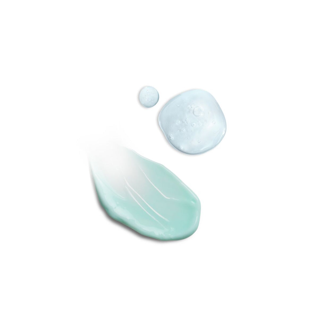 Close-up of light blue cream with a droplet on a white background