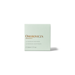 A square, pale mint green box of Omorovicza Budapest Ultramood Mud Mask, featuring gold and black text, centered on a clean white background with a soft shadow.