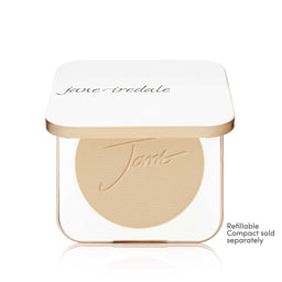 A Jane Iredale makeup compact with a white lid and gold trim, showing a round beige pressed powder pan inside. Small text on the bottom right reads 'Refillable Compact sold separately'.