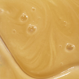 Close-up of a smooth, beige-colored surface with subtle variations