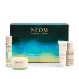 NEOM wellbeing collection with products and box on a white background