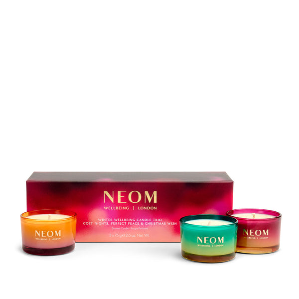 NEOM candle set with three candles and a box on a white background