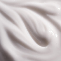 Close-up of white cream or paint with a smooth texture