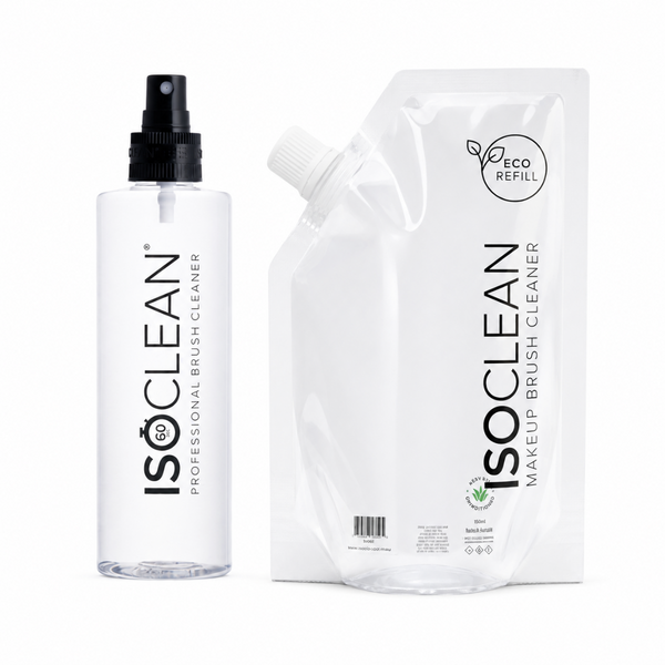 Isoclean professional makeup brush cleaner shown as a clear spray bottle with a black pump next to a white refill pouch labeled 'Isoclean Makeup Brush Cleaner Eco Refill'.