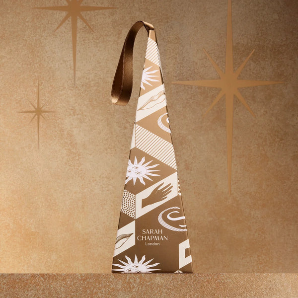 Decorative bottle-shaped box with geometric pattern on a brown textured background