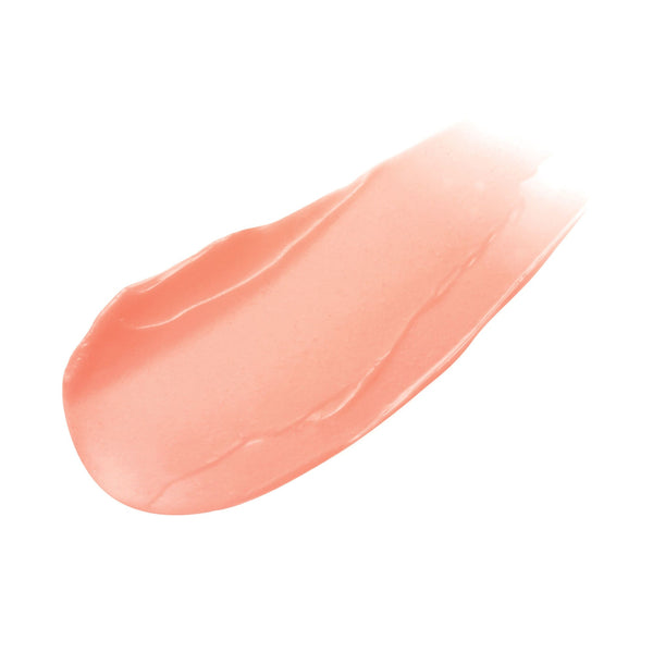 Peach-colored lip balm swatch on a white background