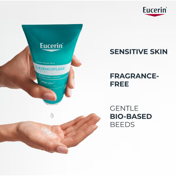 Eucerin Dermopure tube with a hand applying cream, on a white background