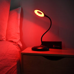 Blue Light Blocking Lamp Glowing on Bedside Table