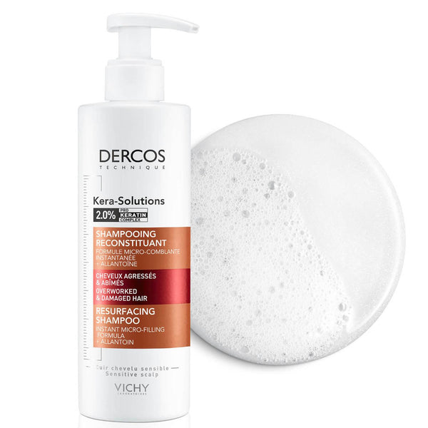 Vichy Dercos Kera-Solutions Resurfacing Shampoo 250ml bottle next to splotch