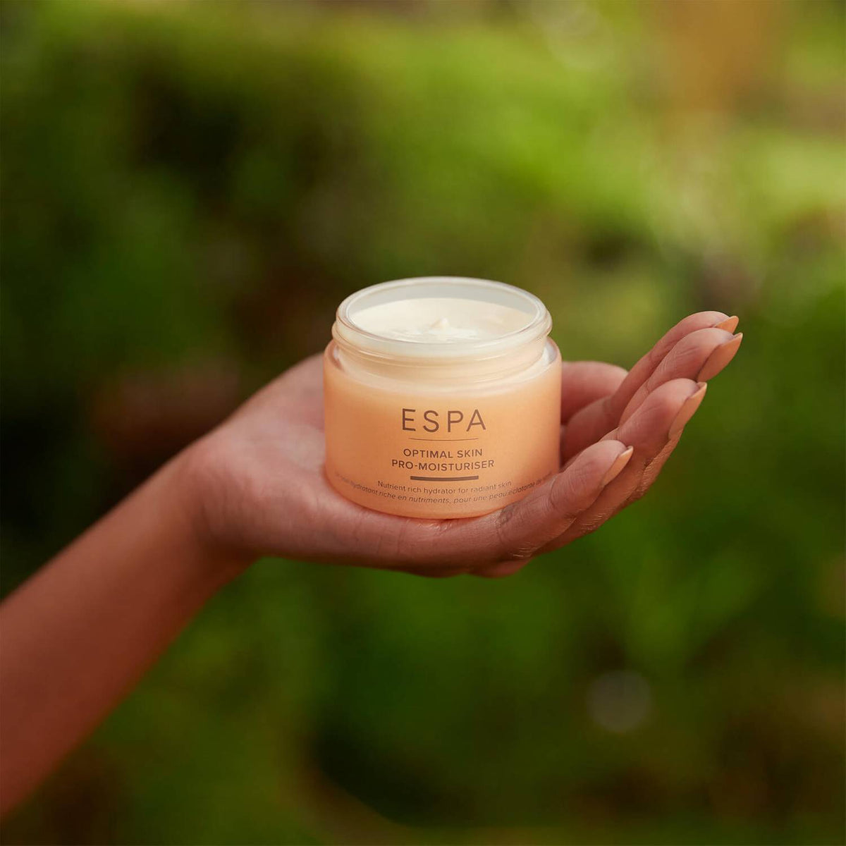 ESPA Optimal Skin ProMoisturiser held in the palm of a hand