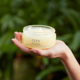 ESPA Yuzu & Ginger Cleansing Sorbet held in the palm of a hand