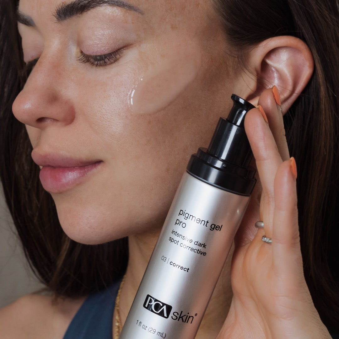 women applying gel to her face