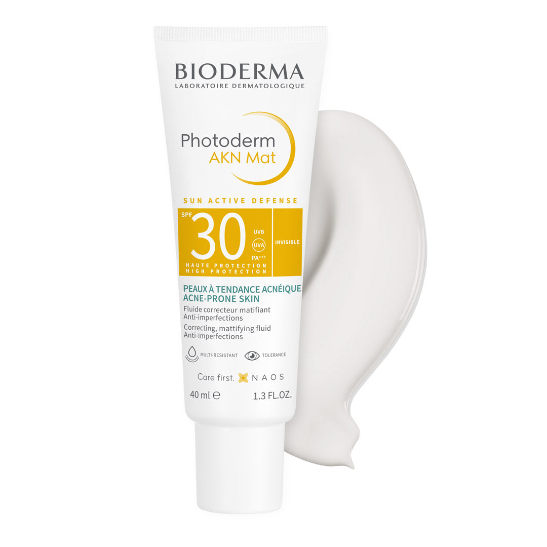 Bioderma Photoderm AKN Mat SPF 30 for Combination Acne-Prone Skin with its contents behind it