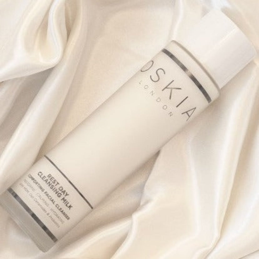 OSKIA Rest Day Comforting Cleansing Milk on a silk cloth